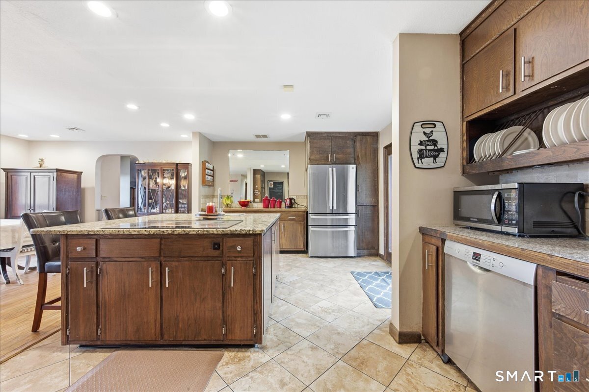 110 Butlertown Road Waterford, CT 06385 - Photo 5 of 35 a kitchen with stainless steel appliances granite countertop a sink and cabinets