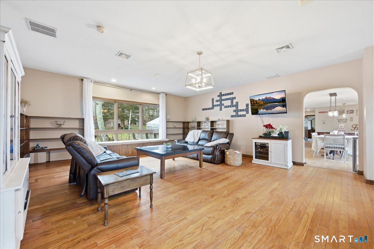 110 Butlertown Road Waterford, CT 06385 - Photo 9 of 35 a living room with furniture and a table