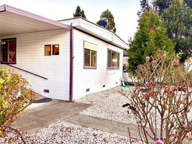 a view of a house with a small yard