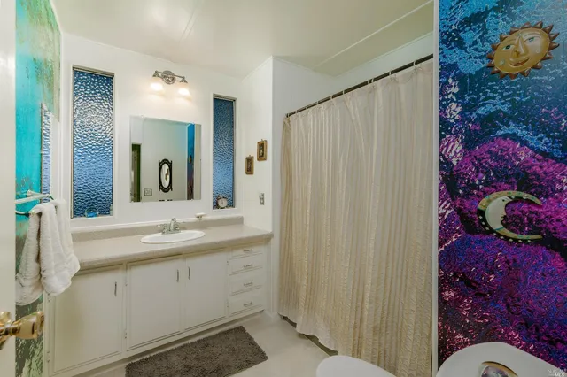 a bathroom with a sink and mirror