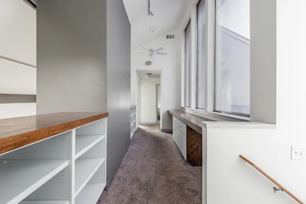 a view of a kitchen from the hallway