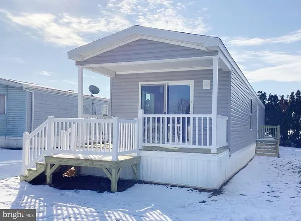 a view of a house with wooden deck