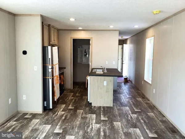 a kitchen with a refrigerator and a stove