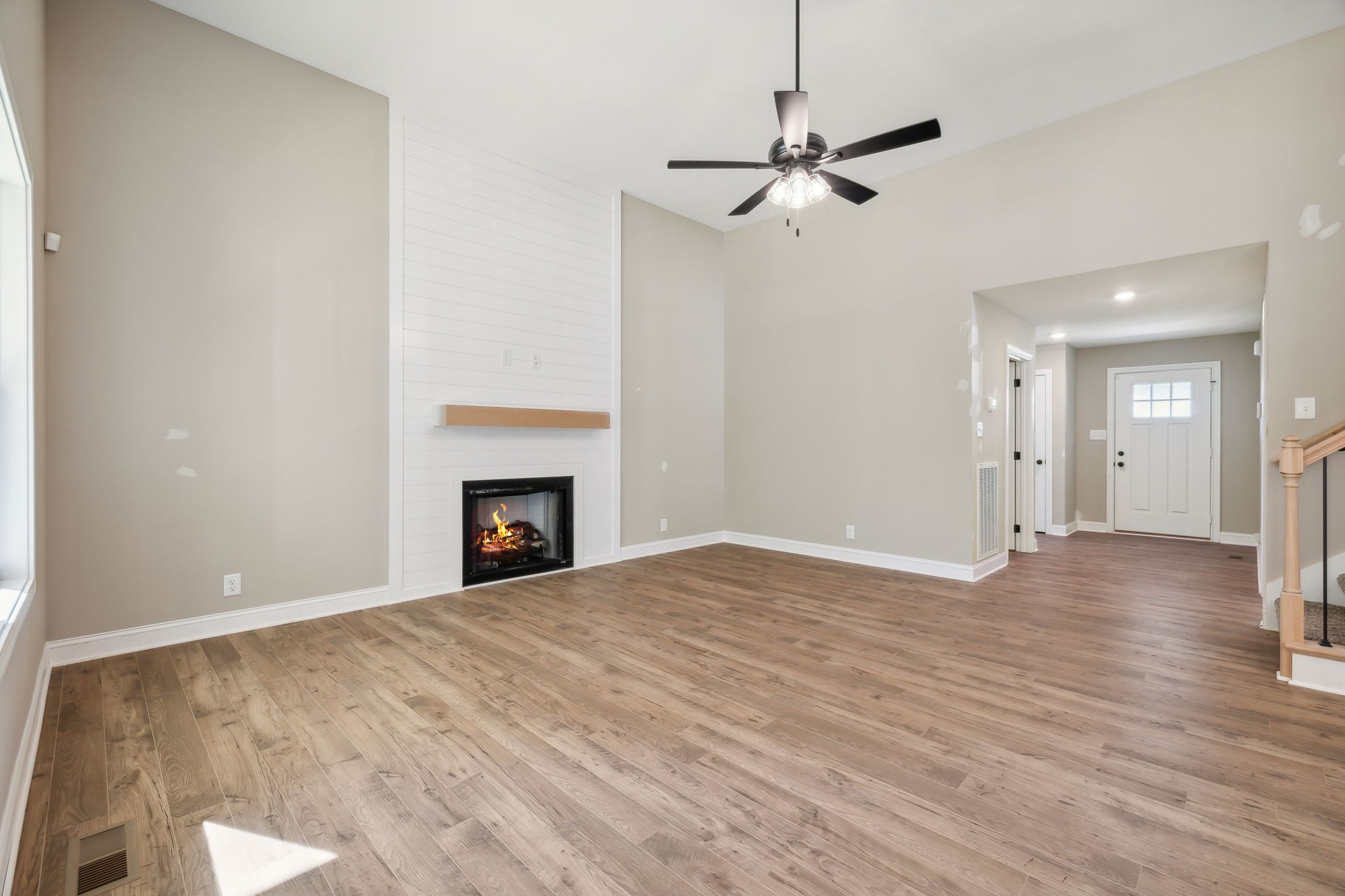 1228 Racker Drive Clarksville, TN 37043 - Photo 8 of 49 a view of empty room with wooden floor and fireplace