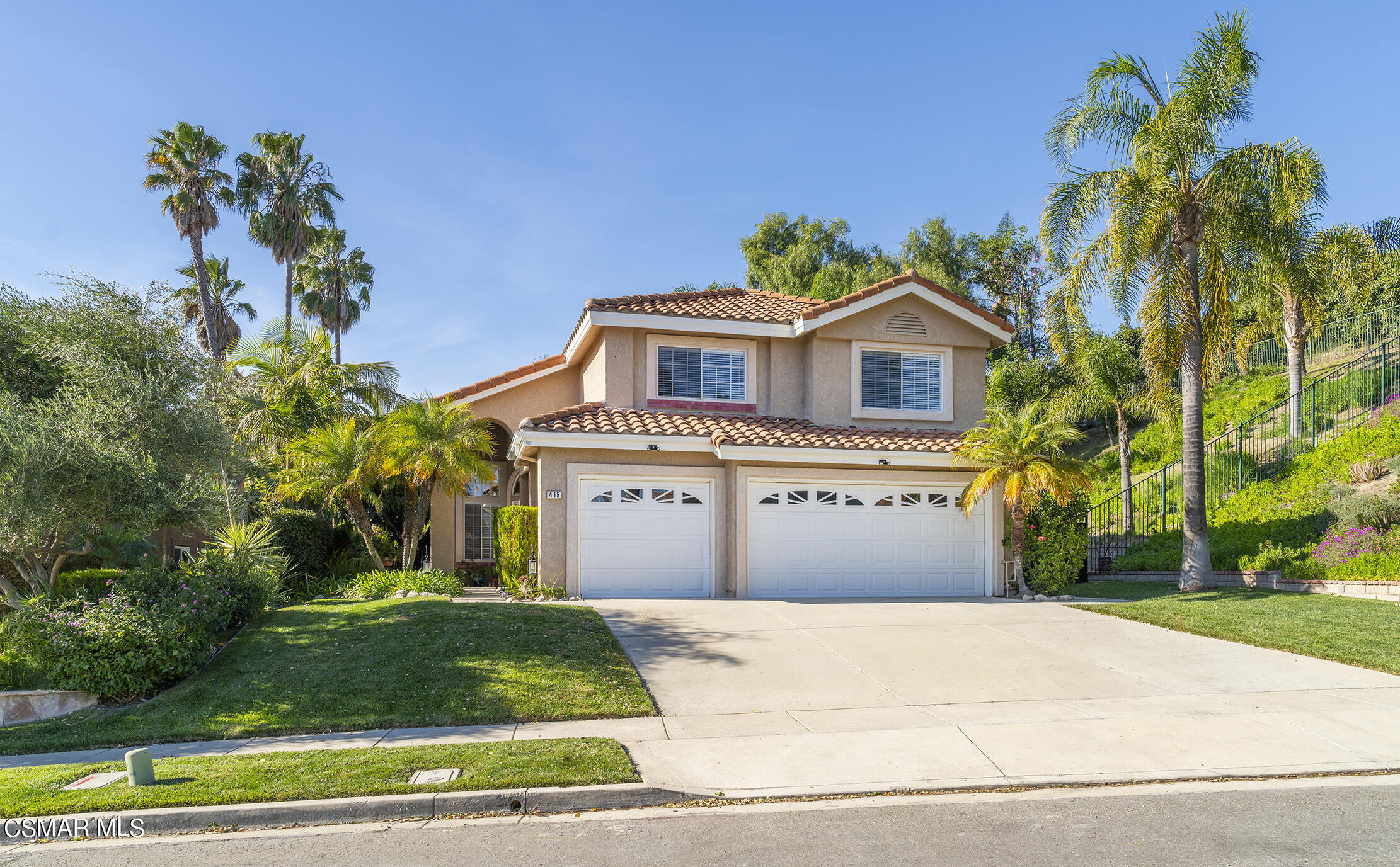 415 Fresh Meadows Road Simi Valley, CA 93065 - Photo 2 of 49 a front view of a house with a garden