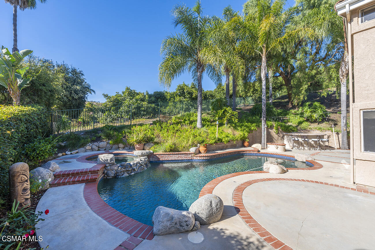 415 Fresh Meadows Road Simi Valley, CA 93065 - Photo 30 of 49 a swimming pool with outdoor seating and yard