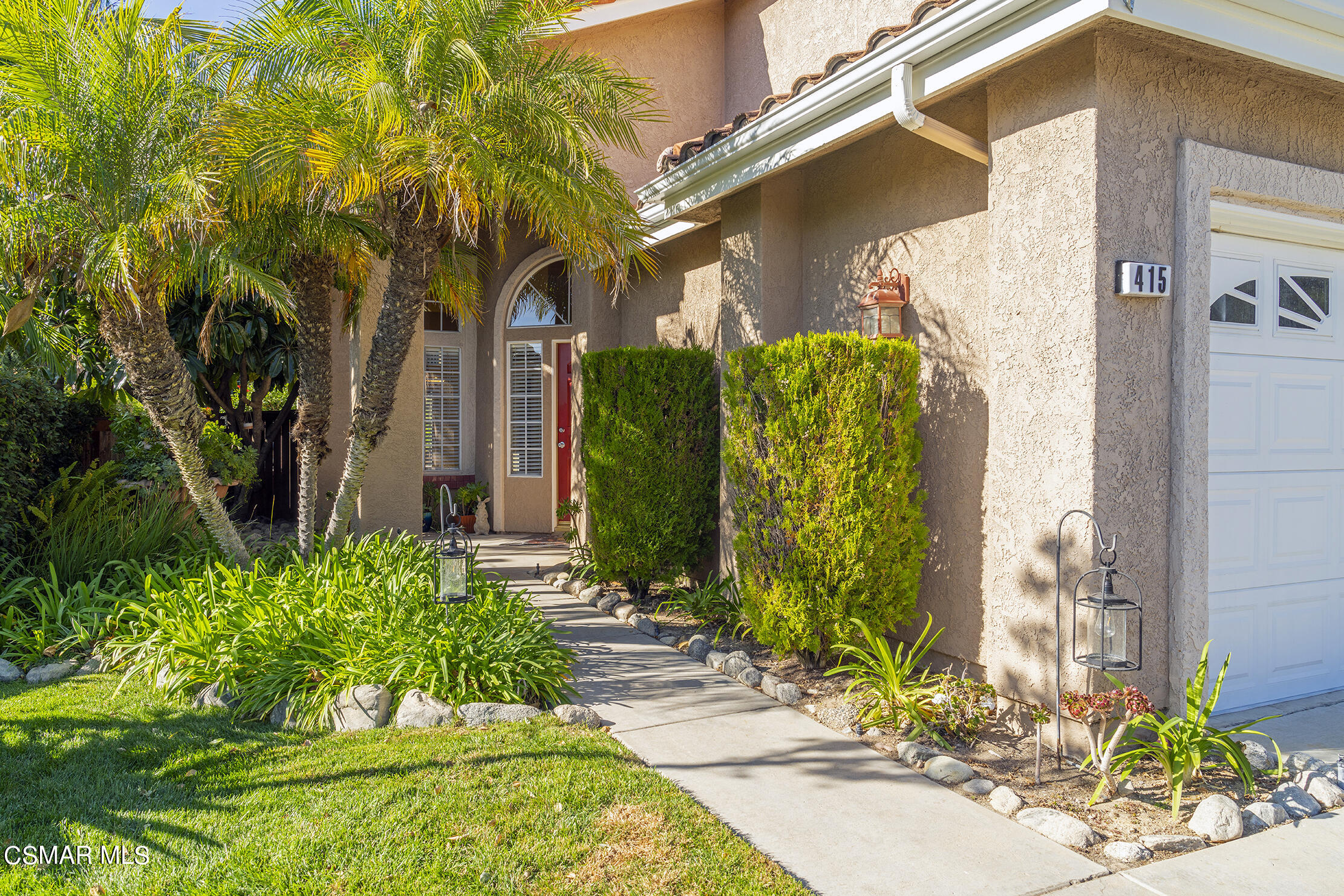 415 Fresh Meadows Road Simi Valley, CA 93065 - Photo 3 of 49 a front view of a house with garden