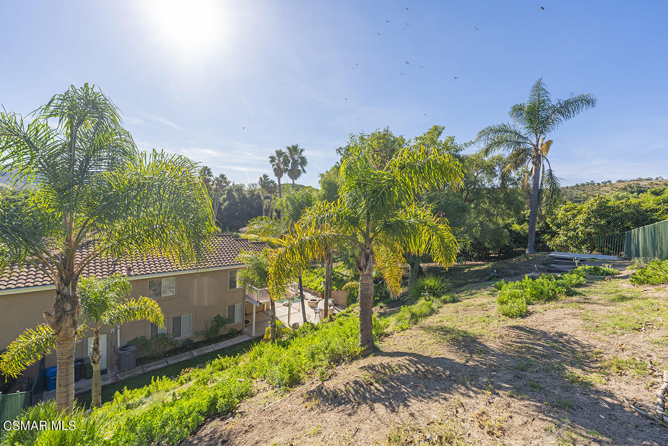 415 Fresh Meadows Road Simi Valley, CA 93065 - Photo 40 of 49 a backyard of a house with a garden and outdoor seating