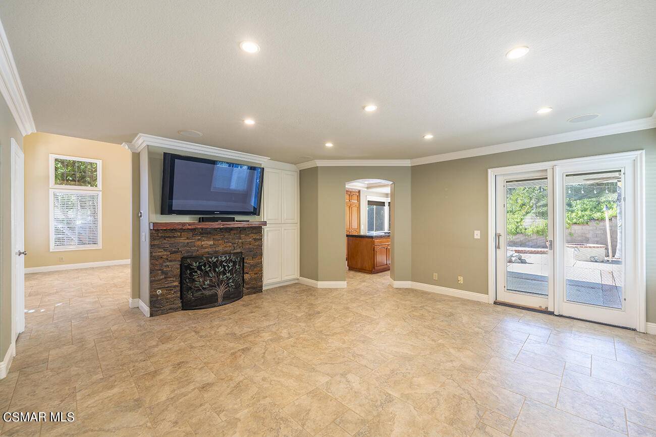 415 Fresh Meadows Road Simi Valley, CA 93065 - Photo 8 of 49 an empty room with furniture and a fireplace