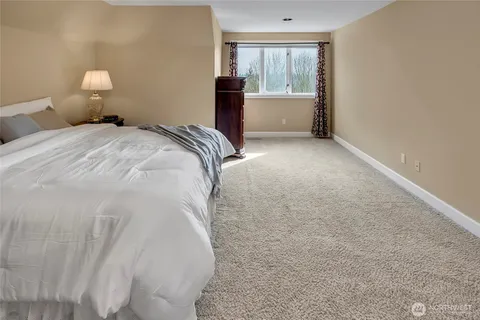 a bedroom with a bed and a view of bathroom