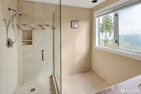 a bathroom with a granite countertop sink mirror and double