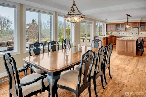 a dining table and chairs in a kitchen