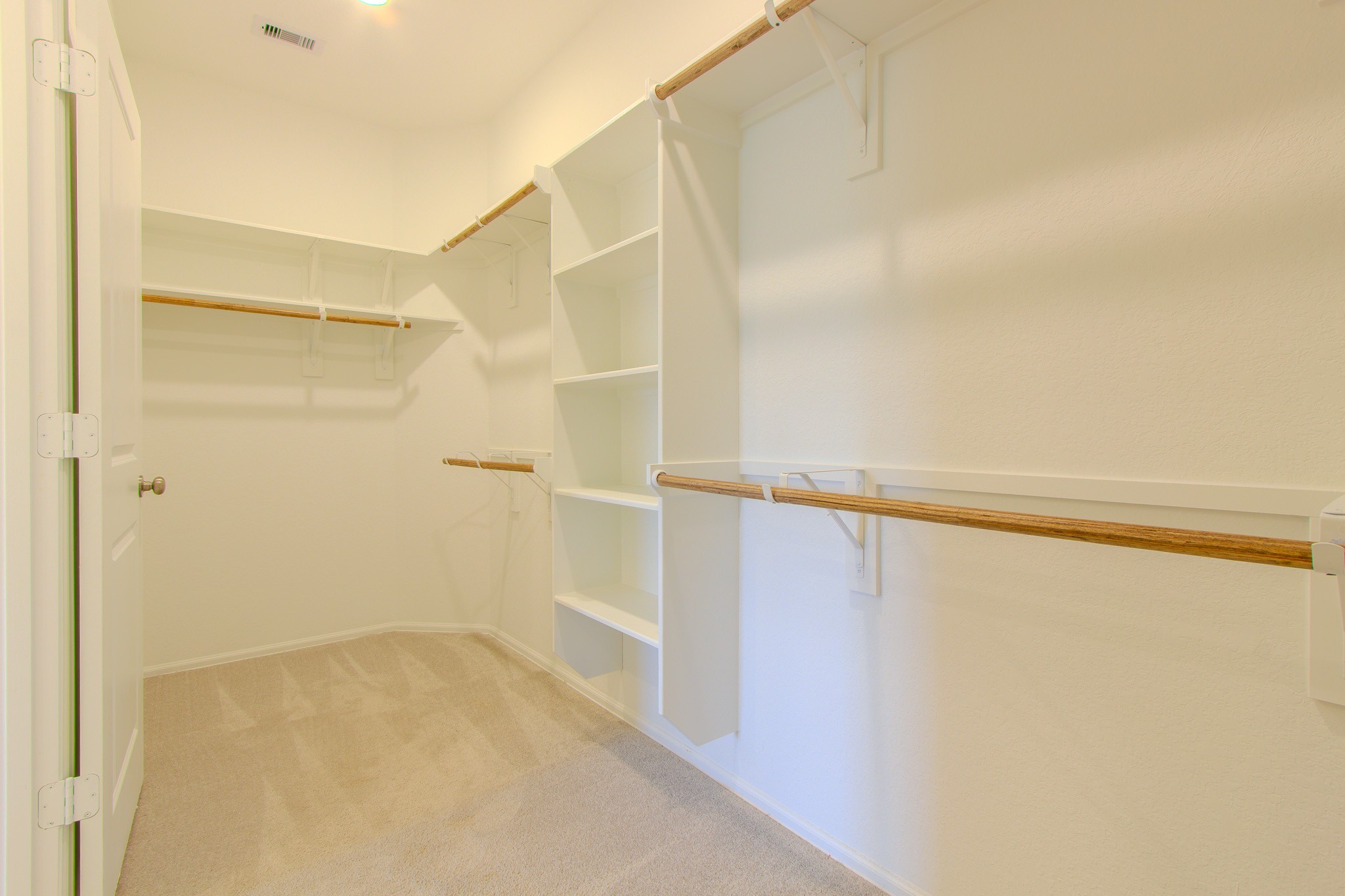 3113 Catalonion Court Conroe, TX 77301 - Photo 26 of 45 a view of walk in closet with empty racks