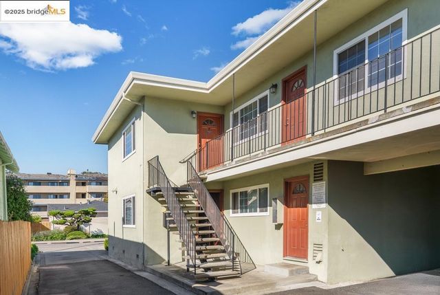 a view of an buildings with wooden stairs
