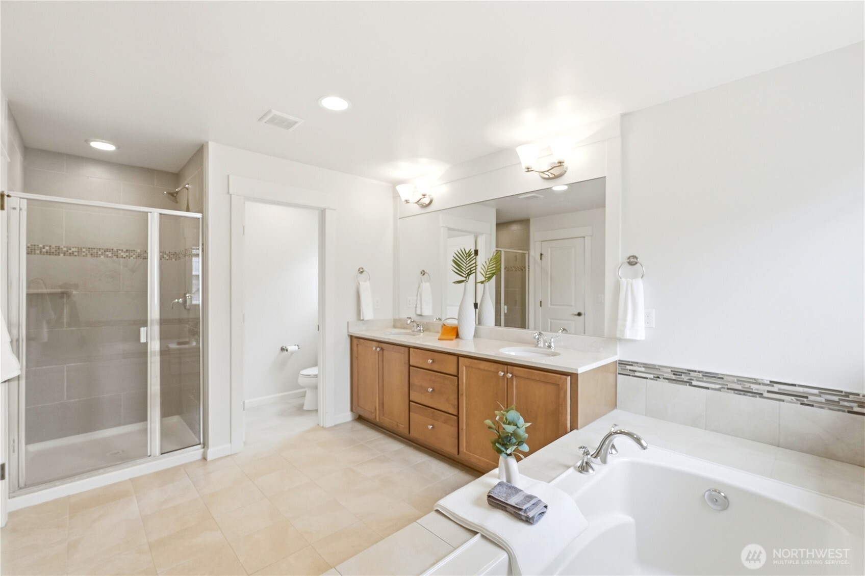 4413 185th Place Southeast Bothell, WA 98012 - Photo 23 of 40 a bathroom with a tub sink shower and two mirror
