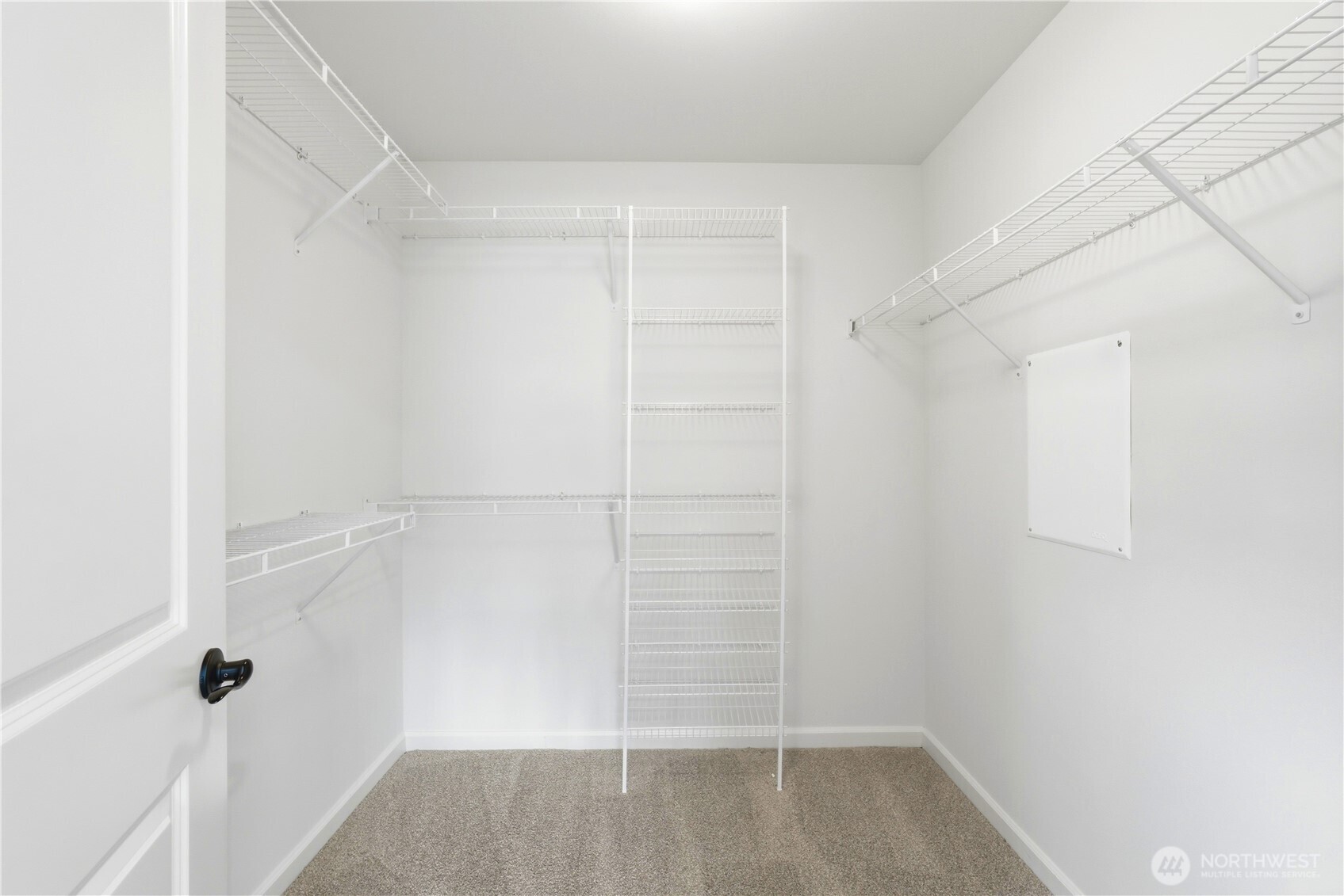 4413 185th Place Southeast Bothell, WA 98012 - Photo 24 of 40 a view of walk in closet with empty racks