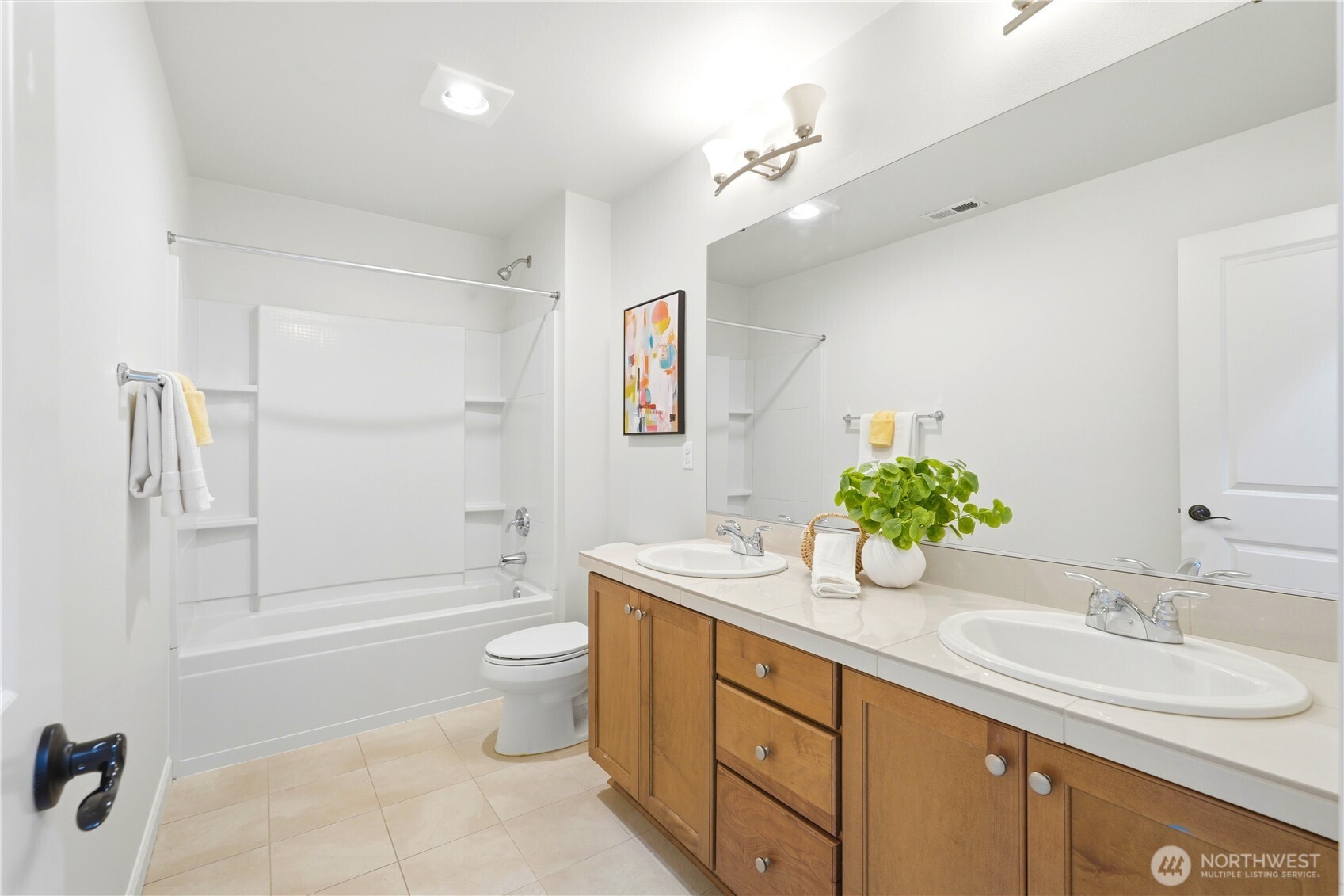 4413 185th Place Southeast Bothell, WA 98012 - Photo 27 of 40 a spacious bathroom with a granite countertop sink a toilet a shower and a mirror