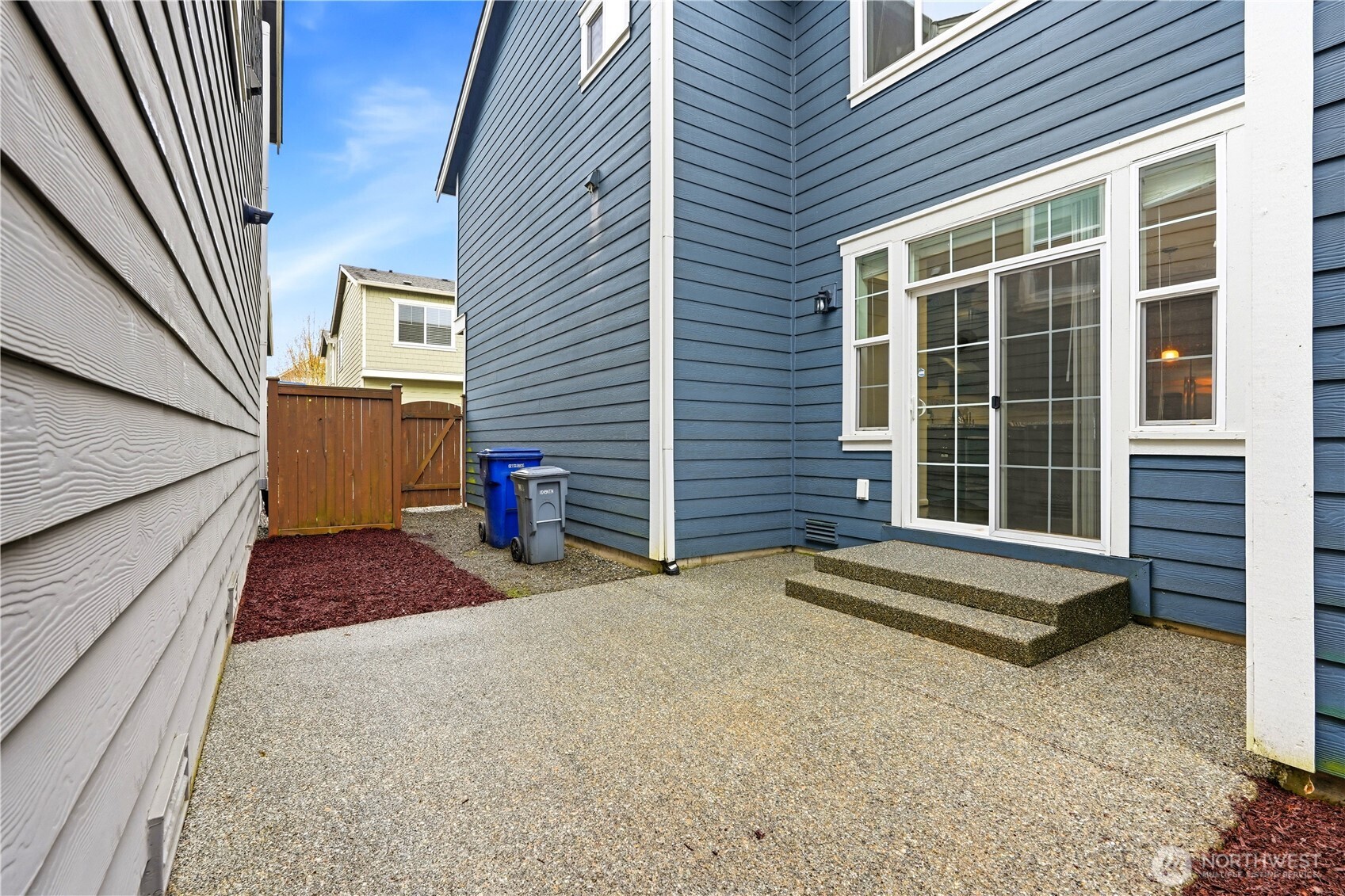 4413 185th Place Southeast Bothell, WA 98012 - Photo 31 of 40 a view of a house with a barbeque and wooden stairs