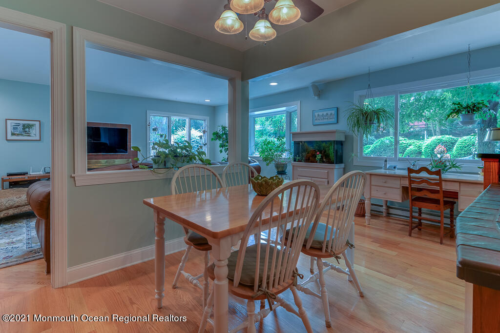 2 Flora Drive Holmdel, NJ 07733 - Photo 17 of 34 a view of a dining room with furniture window and wooden floor