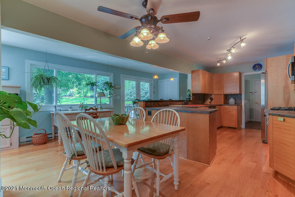 2 Flora Drive Holmdel, NJ 07733 - Photo 18 of 34 a view of a dining room with furniture window and outside view