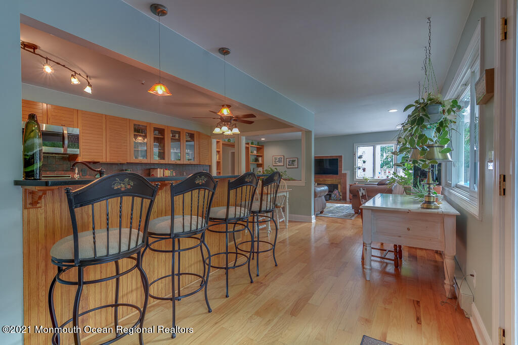 2 Flora Drive Holmdel, NJ 07733 - Photo 20 of 34 a view of a dining room with furniture and wooden floor