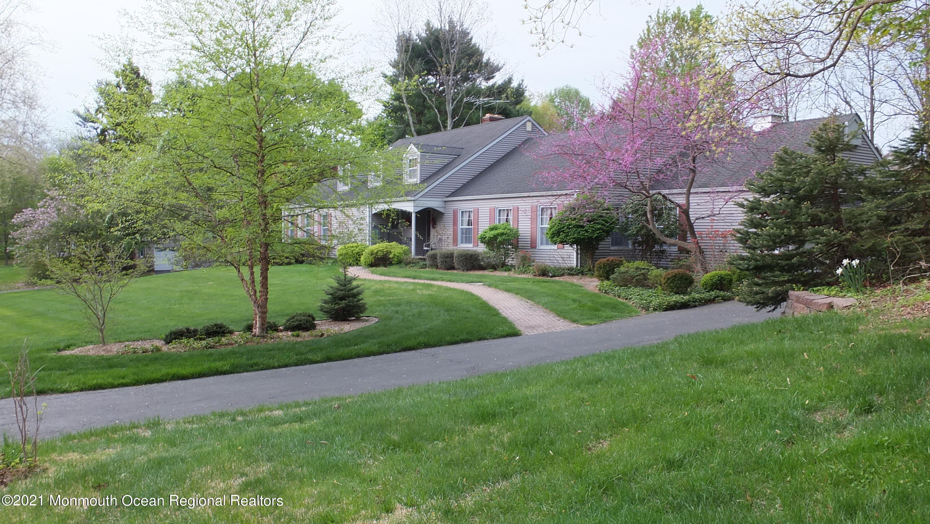 2 Flora Drive Holmdel, NJ 07733 - Photo 3 of 34 a view of a house next to a yard with big trees