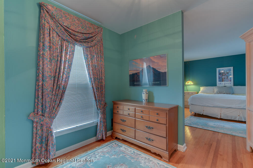 2 Flora Drive Holmdel, NJ 07733 - Photo 22 of 34 a bedroom with a bed and a dresser