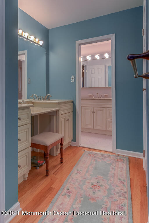 2 Flora Drive Holmdel, NJ 07733 - Photo 23 of 34 a view of a hallway that has a table and chairs in it