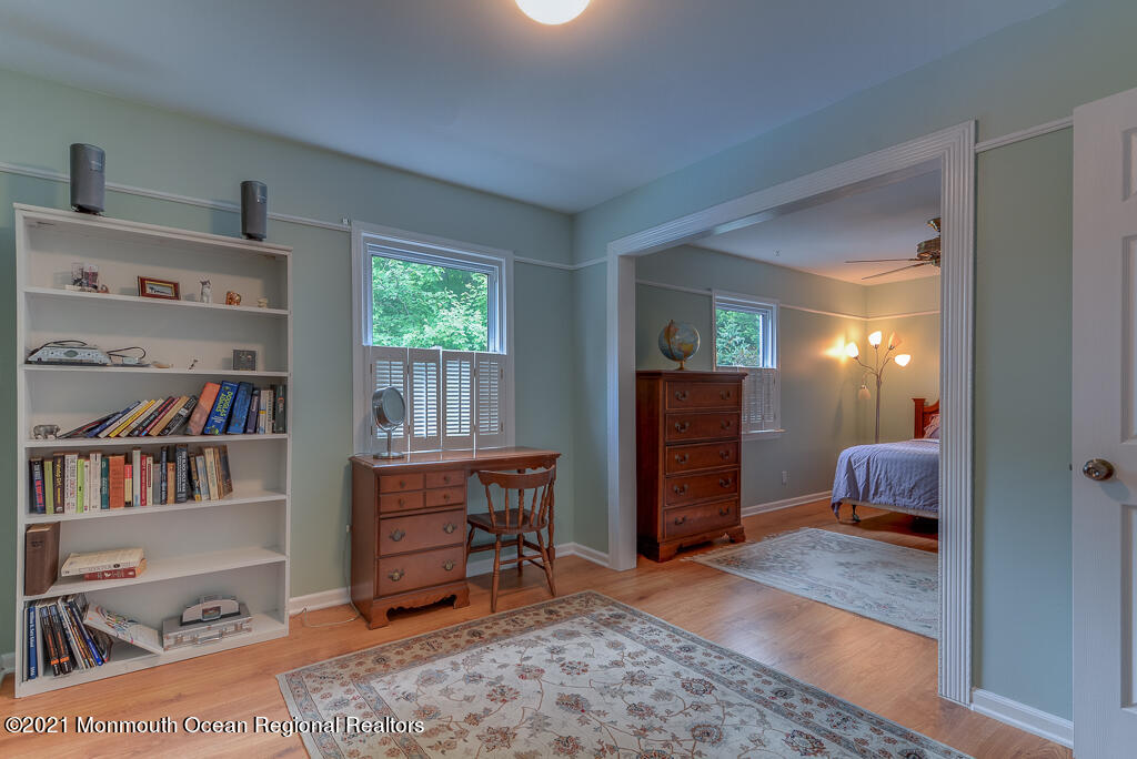 2 Flora Drive Holmdel, NJ 07733 - Photo 28 of 34 a room with furniture and a book shelf