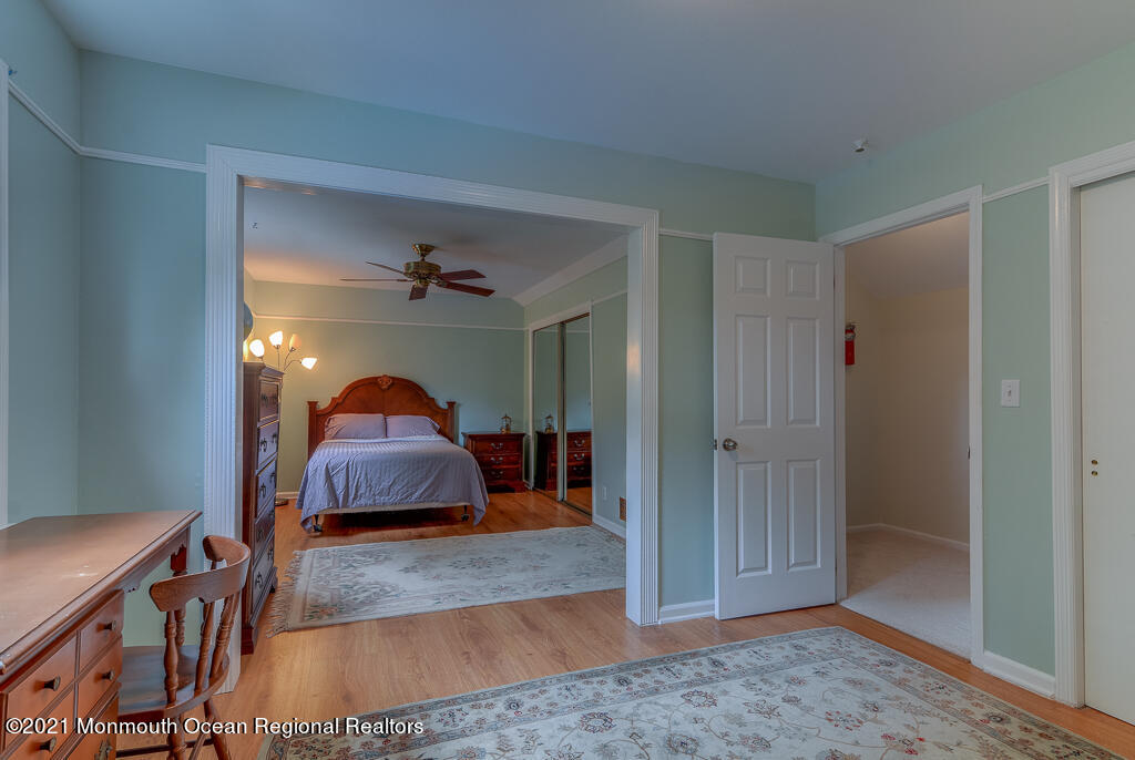 2 Flora Drive Holmdel, NJ 07733 - Photo 29 of 34 a living room with furniture and a chandelier