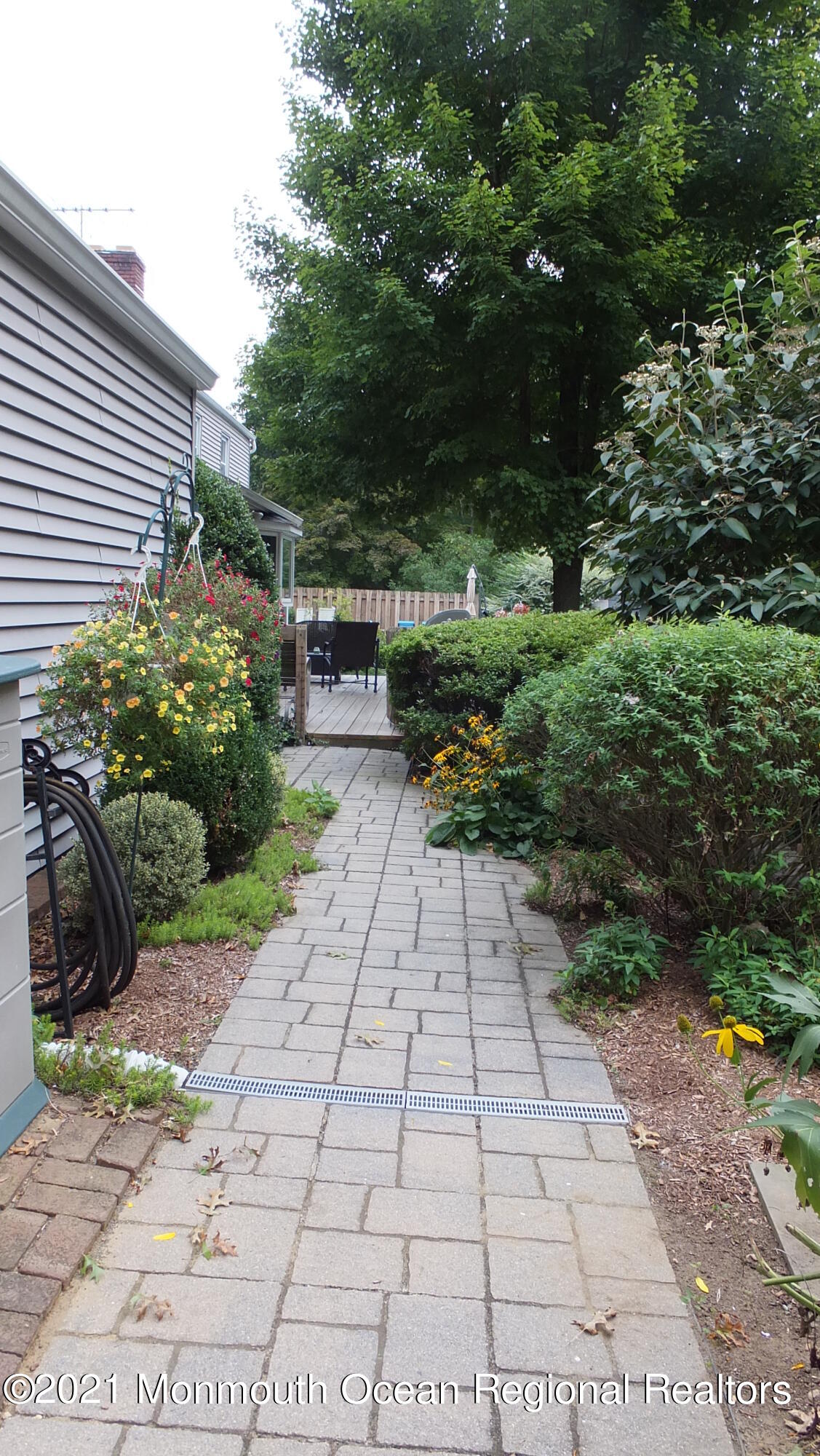 2 Flora Drive Holmdel, NJ 07733 - Photo 4 of 34 a view of a pathway with a garden