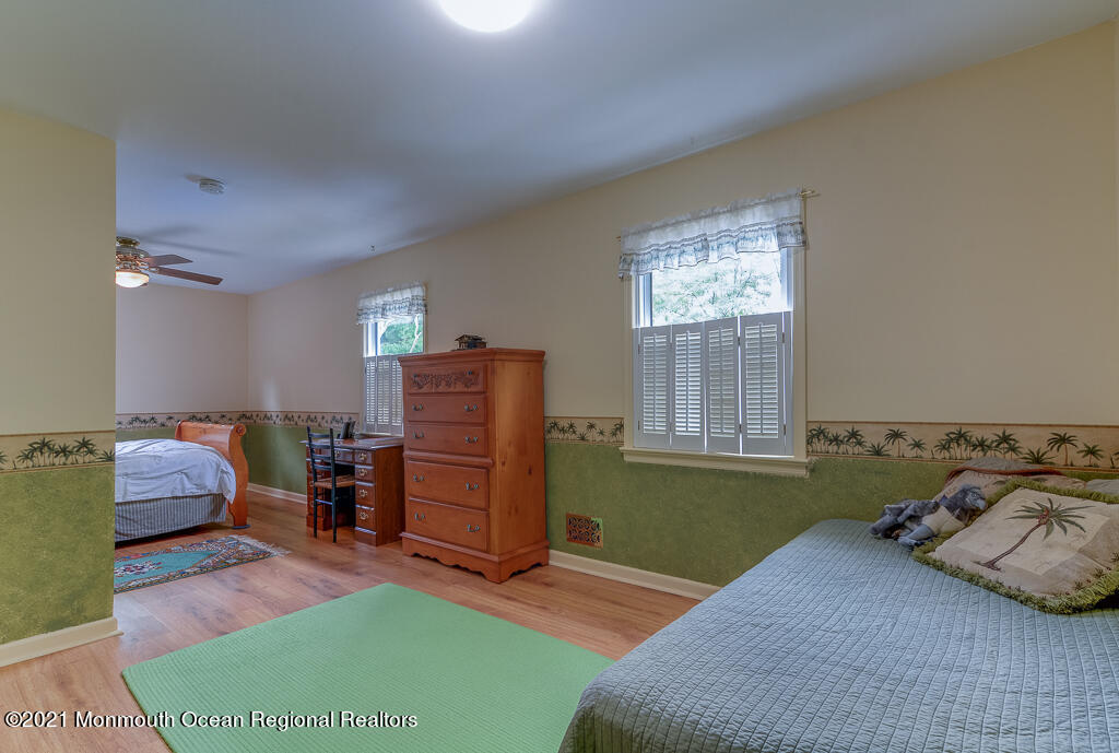 2 Flora Drive Holmdel, NJ 07733 - Photo 31 of 34 a bedroom with a bed and furniture