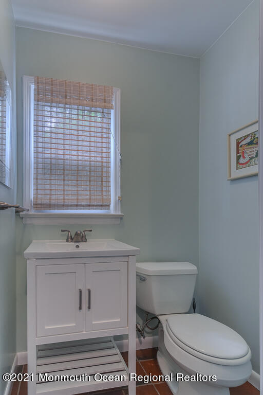 2 Flora Drive Holmdel, NJ 07733 - Photo 33 of 34 a bathroom with a toilet a sink and a window