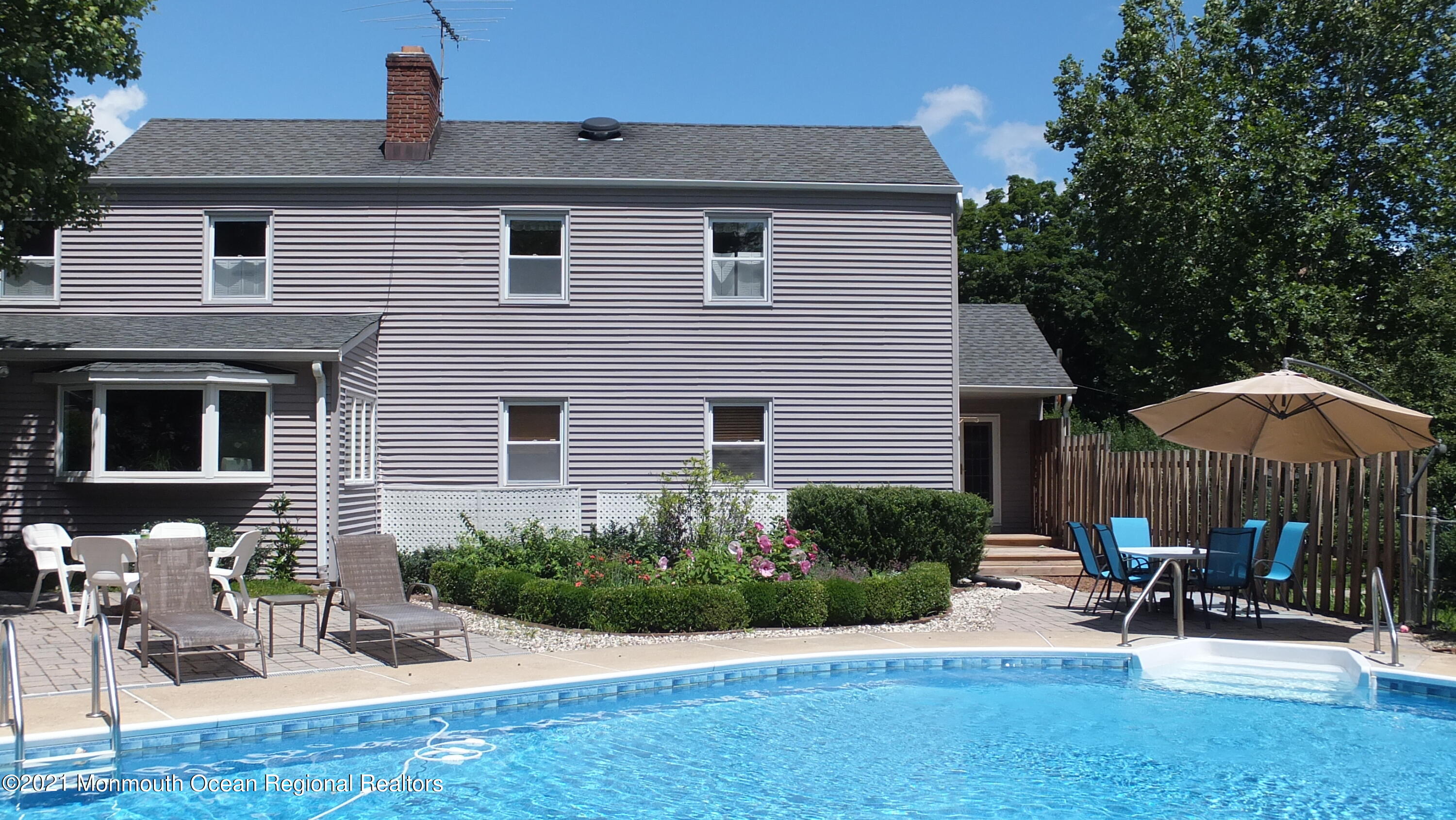 2 Flora Drive Holmdel, NJ 07733 - Photo 6 of 34 a front view of a house with patio