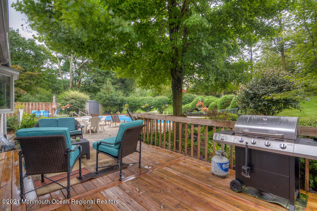 2 Flora Drive Holmdel, NJ 07733 - Photo 7 of 34 a view of a deck with a table and chairs