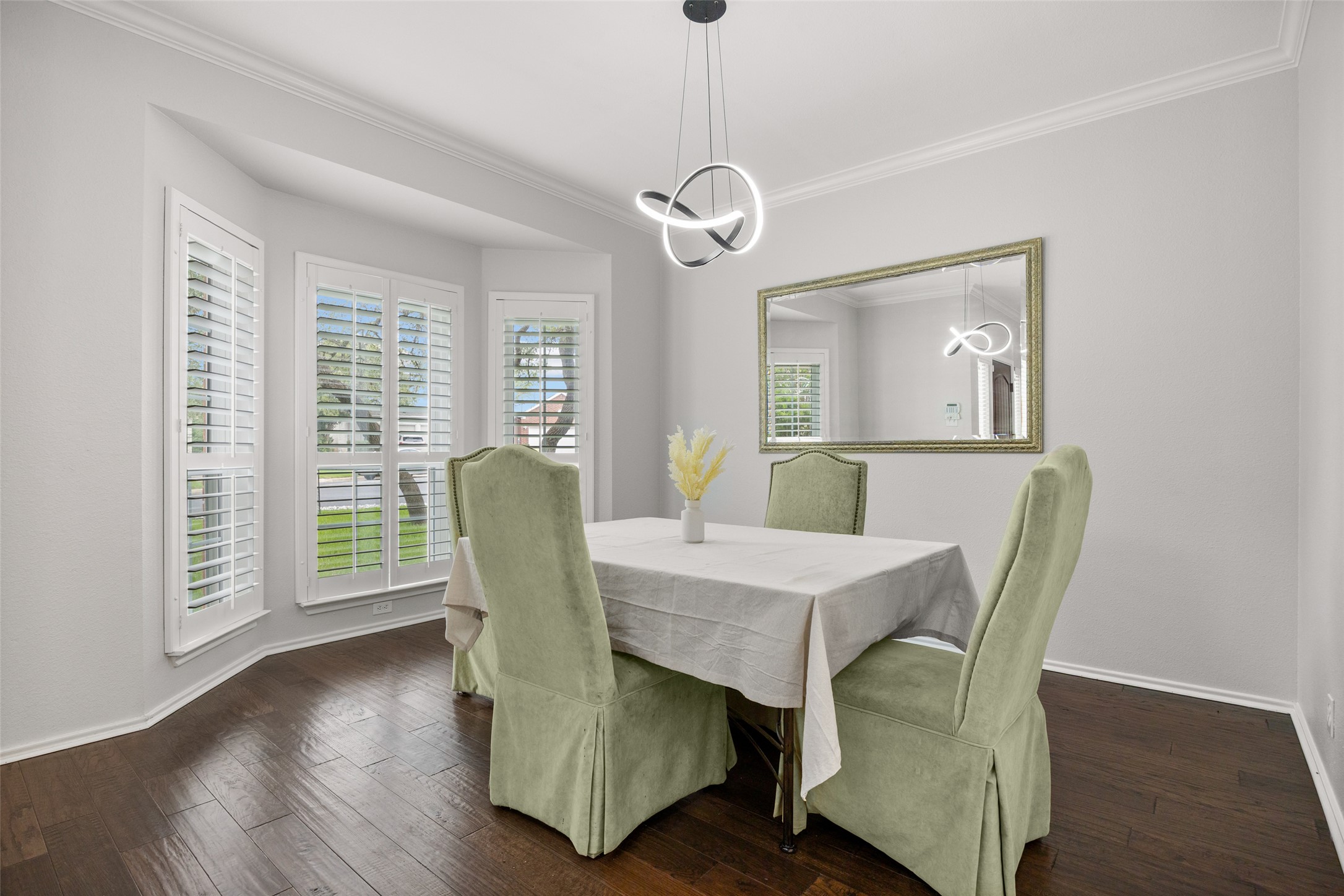 8610 Axis Drive Austin, TX 78749 - Photo 12 of 29 a view of a dining room with furniture window and wooden floor