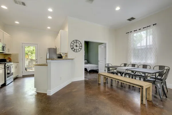 a kitchen with a stove and a refrigerator