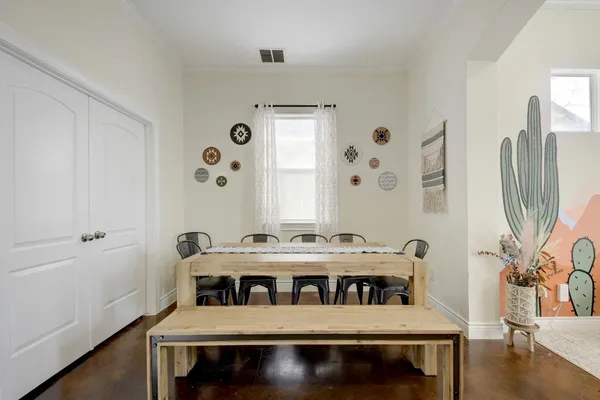 a view of a dining room with furniture window and wooden floor