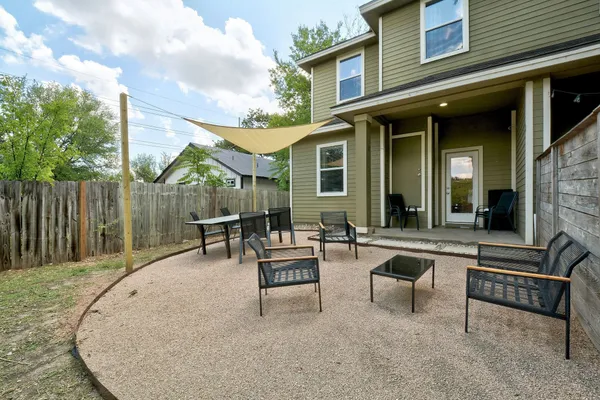 a view of a backyard with a patio