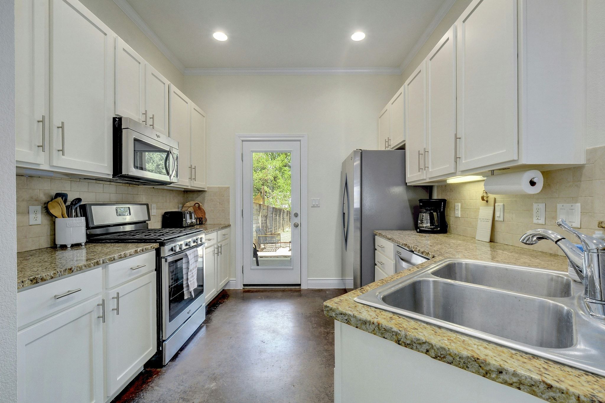 2206 East 14th Street, Unit 2 Austin, TX 78702 - Photo 8 of 32 Spacious eat-in kitchen designed for both everyday living and hosting.