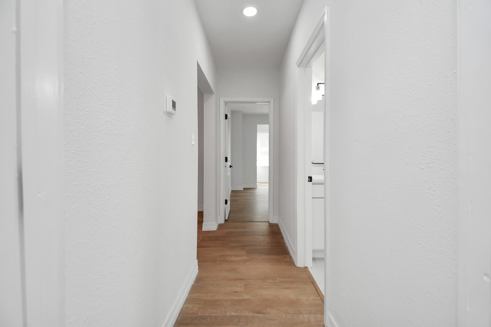 2812 Truxillo Street, Unit B Houston, TX 77004 - Photo 27 of 32 a view of a hallway with wooden floor