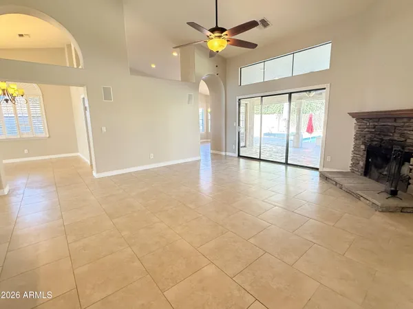 a view of an empty room with a fireplace