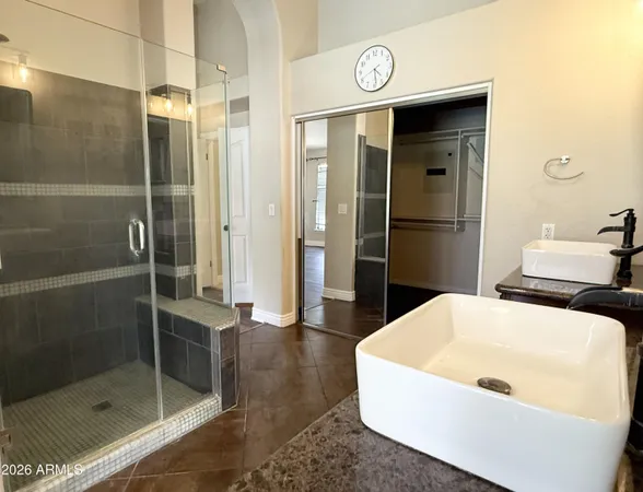 a bathroom with a tub and shower