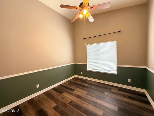 a view of room with window and ceiling fan