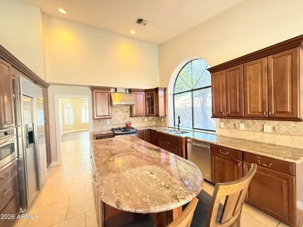 a view of a kitchen with a sink and cabinets