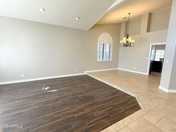 a view of a room with wooden floor and staircase