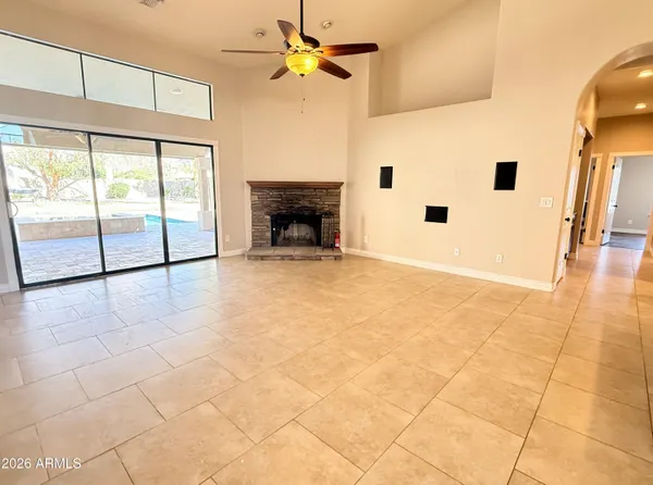 a view of an empty room with a fireplace