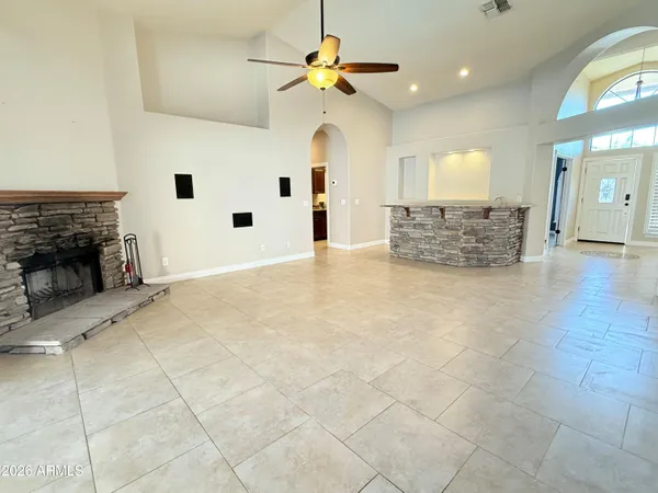a view of an empty room with a fireplace