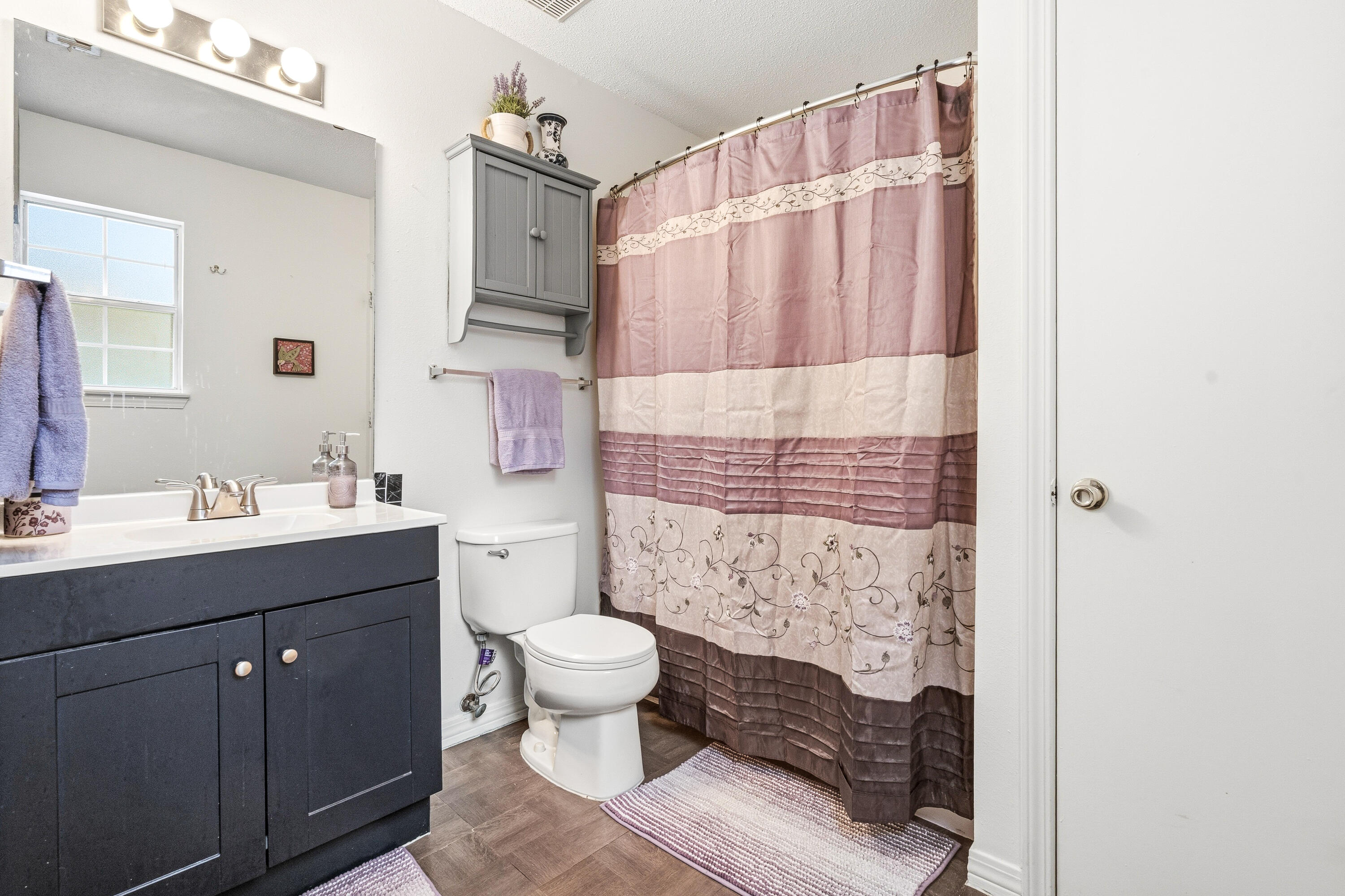 2880 Aplin Road Crestview, FL 32539 - Photo 28 of 33 a bathroom with a sink toilet and shower