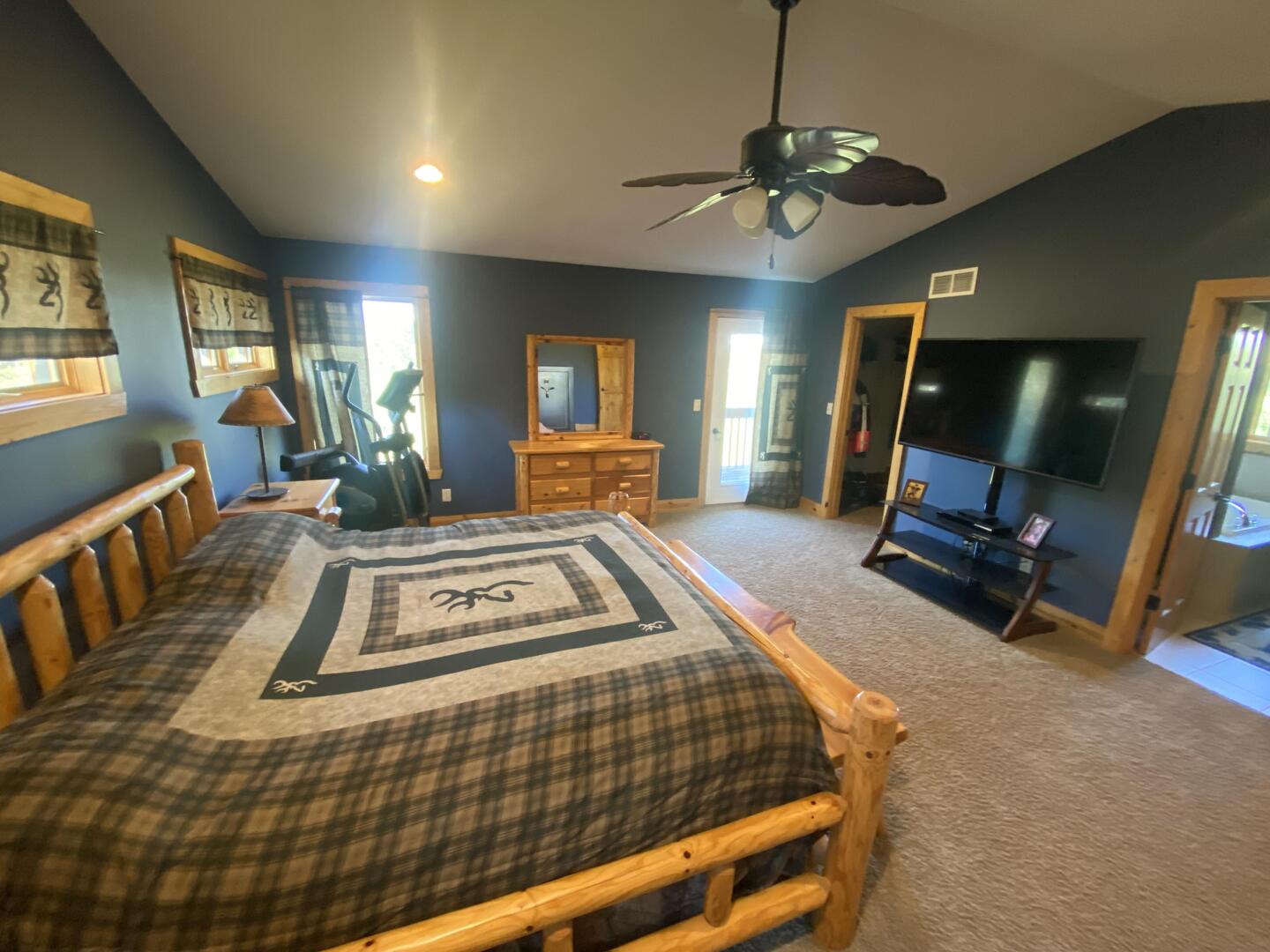 7330 North Crestview Road Stillman Valley, IL 61084 - Photo 11 of 33 a living room with furniture a flat screen tv and a chandelier